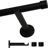 A black curtain rod and its mounting bracket are shown against a white background. Below the main rod assembly, a separate bracket and two end caps are displayed. Podgląd zdjęcia produktu
