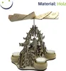 A wooden Christmas pyramid with four tealight holders, decorated with Christmas tree motifs and small figures. Produktbild-Vorschau