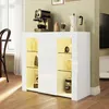 A white high-gloss sideboard with glass shelves and LED lighting, displaying decorative items and kitchen appliances on top. Podgląd zdjęcia produktu