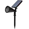 A black solar-powered LED spotlight with a ground stake, shown against a white background. Voir les images du produit