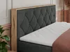 A close-up view of a bed with a tufted headboard and a mattress. Produktbild-Vorschau