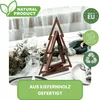 A wooden Christmas tree decoration set on a table with festive elements. Produktbild-Vorschau