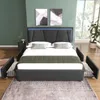 A modern bedroom with a bed and artwork on the wall.