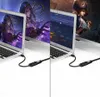 Two laptops are shown, each connected to an external display via a cable and adapter. The displays show different game-related graphics. Voir les images du produit