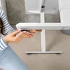 A person is assembling a white adjustable desk. Produktbild-Vorschau