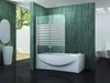 A modern bathroom with a bathtub, shower screen, sink, and toilet, featuring green tiled walls and black tiled floors. Produktbild-Vorschau