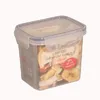 A clear plastic food storage container filled with dried fruit, placed on a white background. Produktbild-Vorschau