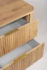 Close-up view of two open drawers of a wooden cabinet with gold handles. Produktbild-Vorschau