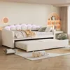 A bedroom scene featuring a daybed with a pull-out trundle, decorated with pillows and blankets, and illuminated by LED lights. Voir les images du produit