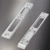 Two silver-colored door strike plates are shown against a gradient background. Produktbild-Vorschau