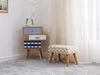 A modern side table with drawers and a patterned stool in a room with sheer curtains. Náhled obrázku produktu