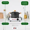 A close-up shot of a portable electric stove with a pot on top, set on a kitchen counter. Produktbild-Vorschau