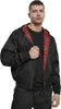 A man wearing a black hooded jacket with a red plaid lining. Náhled obrázku produktu