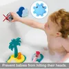 A baby is playing in a bathtub with bath toys, and a hand is reaching for a bath faucet cover. Produktbild-Vorschau