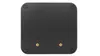 The back of a black square electronic device with four rubber feet and two threaded mounting holes. Produktbild-Vorschau