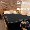 A bed with a black fitted sheet, showing dimensions and a close-up of the sheet's depth. Produktbild-Vorschau