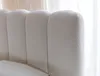 Close-up of a white, textured headboard with vertical channel tufting. Náhled obrázku produktu