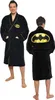 A man wearing a black Batman-themed bathrobe, shown from the front and back. Podgląd zdjęcia produktu