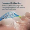 Close-up of a Philips Sonicare toothbrush head cleaning teeth with toothpaste and water. Podgląd zdjęcia produktu