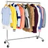 A clothing rack with various garments hanging on it. Anteprima dell’immagine prodotto
