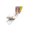 A roll of double-sided tape with the backing peeled off one side. Produktbild-Vorschau