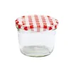 A clear studio shot of a glass jar with a red and white checkered lid. Produktbild-Vorschau