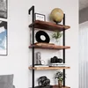 A wooden shelf unit with various decorative items and books. Náhled obrázku produktu