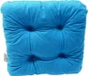 A close-up view of a tufted blue cushion. Podgląd zdjęcia produktu