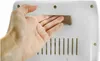 A hand is being inserted into a slot on a white appliance. Náhľad obrázku produktu