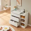 A nursery or child's room with a white changing table and drawers filled with toys, a small table and chair, and a rug. Podgląd zdjęcia produktu