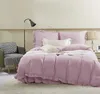 A bedroom scene with a bed, chair, and lamp. Podgląd zdjęcia produktu