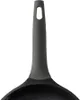 A close-up shot of the handle and upper rim of a frying pan. Náhled obrázku produktu