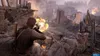 A soldier firing a weapon in a war-torn environment with buildings in ruins and smoke in the background. Náhled obrázku produktu