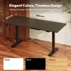 A dark brown standing desk is shown in a room with wooden floors and a wooden wall. There are swatches of white, black, and natural wood colors at the bottom of the image. Náhled obrázku produktu