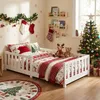 A child's bedroom decorated for Christmas, featuring a bed with festive bedding, a Christmas tree, and holiday decorations. Náhľad obrázku produktu