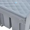 Close-up view of the corner of a gray built-in trash can with a diamond-patterned lid. Anteprima dell’immagine prodotto