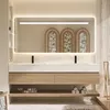 A modern bathroom vanity with a double sink, mirror, and integrated lighting. Produktbild-Vorschau