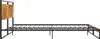 A metal bed frame with a wooden headboard, shown from the side against a white background. Náhled obrázku produktu
