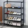 A multi-tiered black metal shoe rack filled with various shoes and a handbag on the top shelf. Náhled obrázku produktu