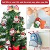 A collage showing Christmas tree ornaments, a keychain, and a backpack charm, all featuring diamond painting designs of gnomes and Santa Claus. Produktbild-Vorschau