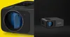 A split image showing a close-up of a projector lens on the left and a full view of the projector on the right. Voir les images du produit