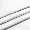 A close-up view of folded white fabric, likely a curtain or textile. Náhled obrázku produktu