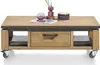A wooden coffee table with a drawer and open shelving on wheels, decorated with a vase and a cylindrical object. Produktbild-Vorschau