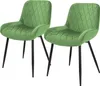 Two green velvet dining chairs with black metal legs are shown against a white background.