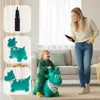 A mother and child are playing with a green inflatable dinosaur toy in a living room. Podgląd zdjęcia produktu