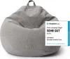 A grey beanbag chair is shown in the center of the image, with a comparison website's award overlay on the right. Produktbild-Vorschau