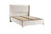 A white upholstered boxspring bed frame with a quilted headboard is shown against a white background. Produktbild-Vorschau