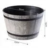A planter pot with dimensions indicated by text overlays. Podgląd zdjęcia produktu