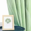 A framed picture with a botanical print sits on a dark blue tray in front of a green curtain with white wavy lines. Produktbild-Vorschau