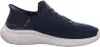 A side view of a navy blue Skechers slip-on sneaker with a white sole. Náhľad obrázku produktu